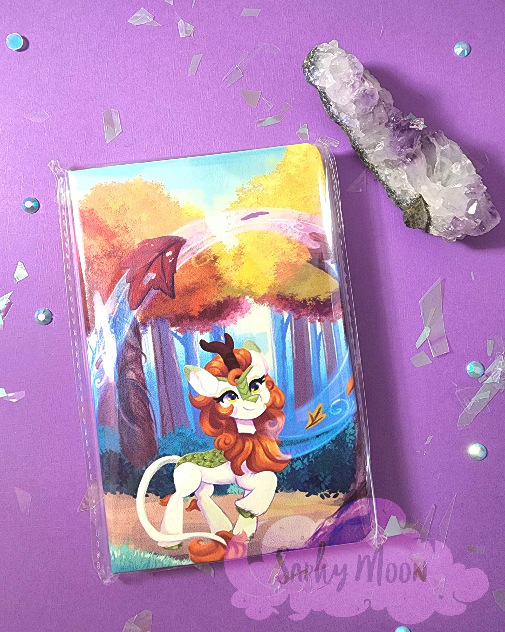 Cartoon character card on a purple background with crystals