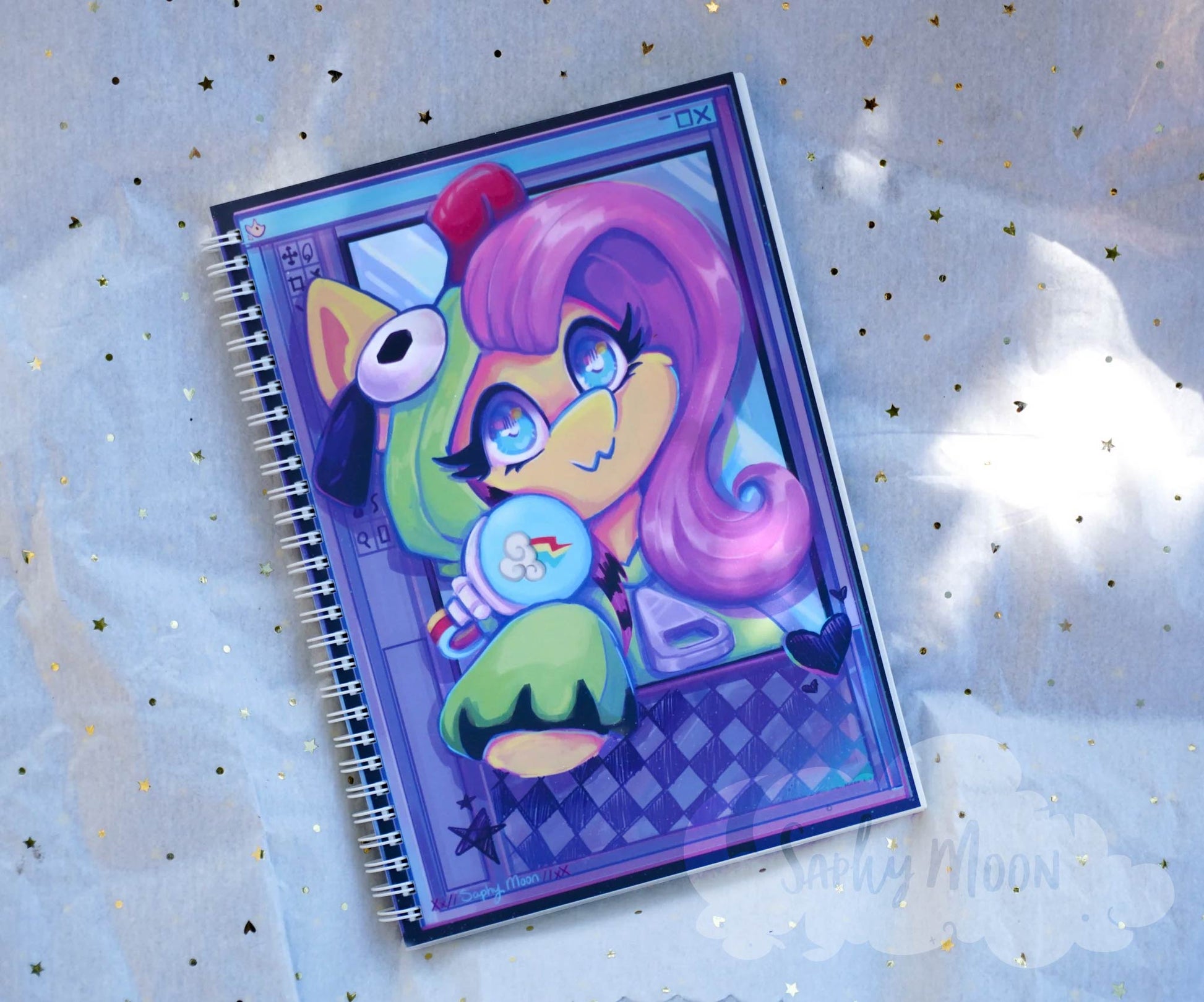 Notebook with a colorful character design on a light blue background