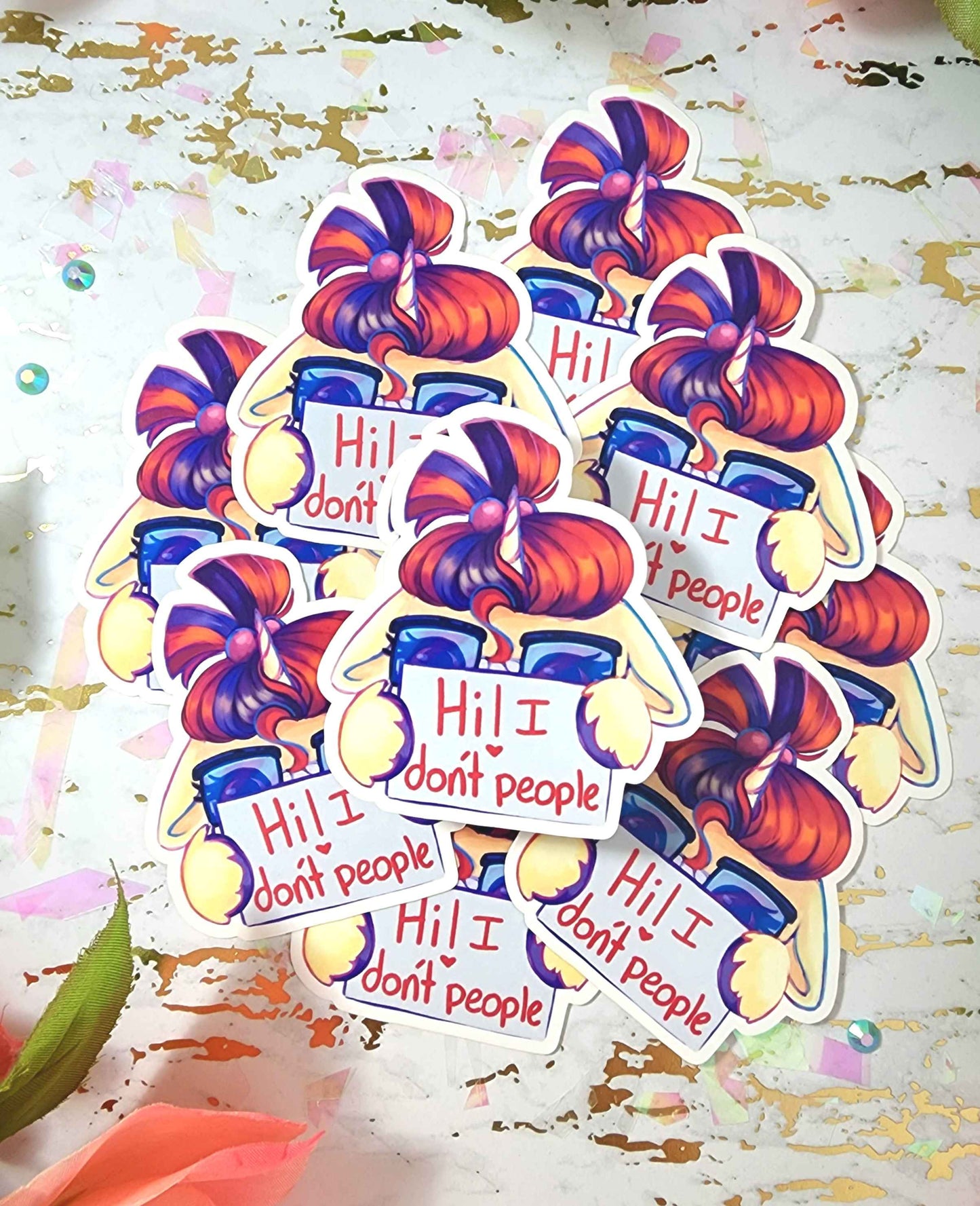 Colorful stickers with pony hiding behind text saying "Hi! I don't people" on a decorative background