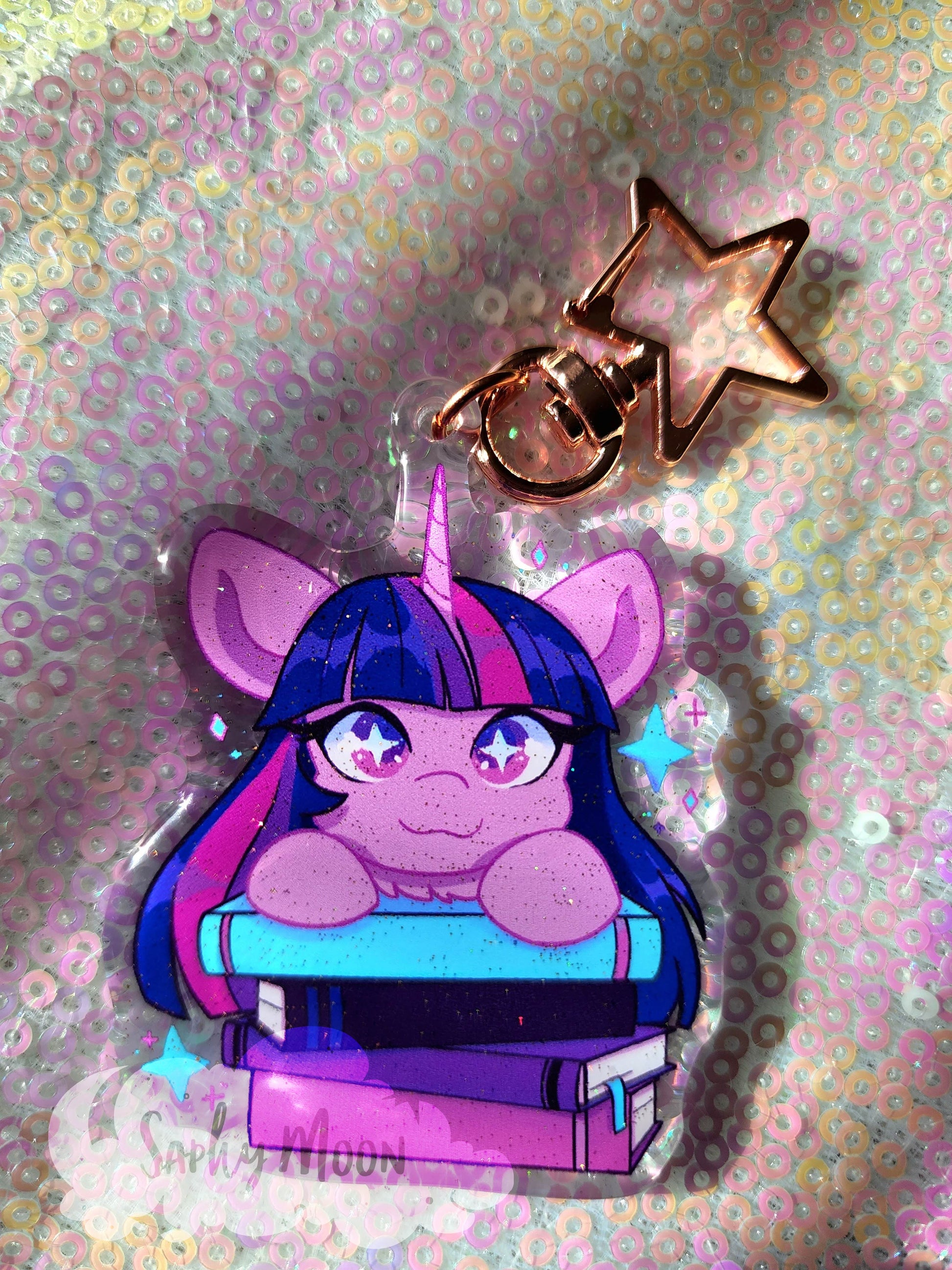 Cartoon character with purple hair and glasses on books against a glittery background