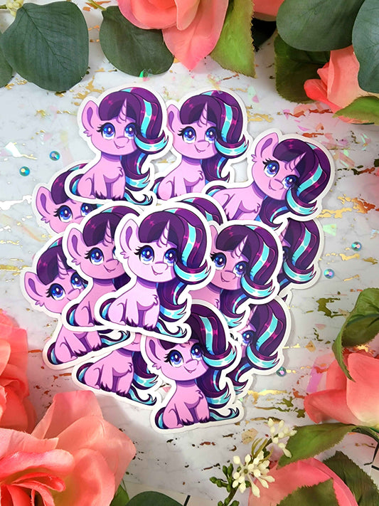 Sticker of a purple and pink character with blue hair on a floral background